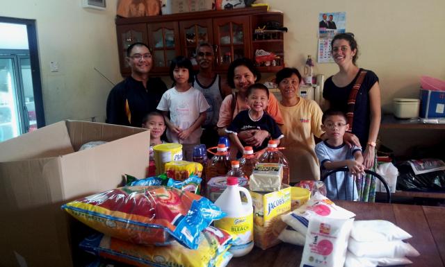 The wonderful Mak family delivering tons of food and kitchen items to our kitchen manager Gilbert and volunteer nurse Marie Genries